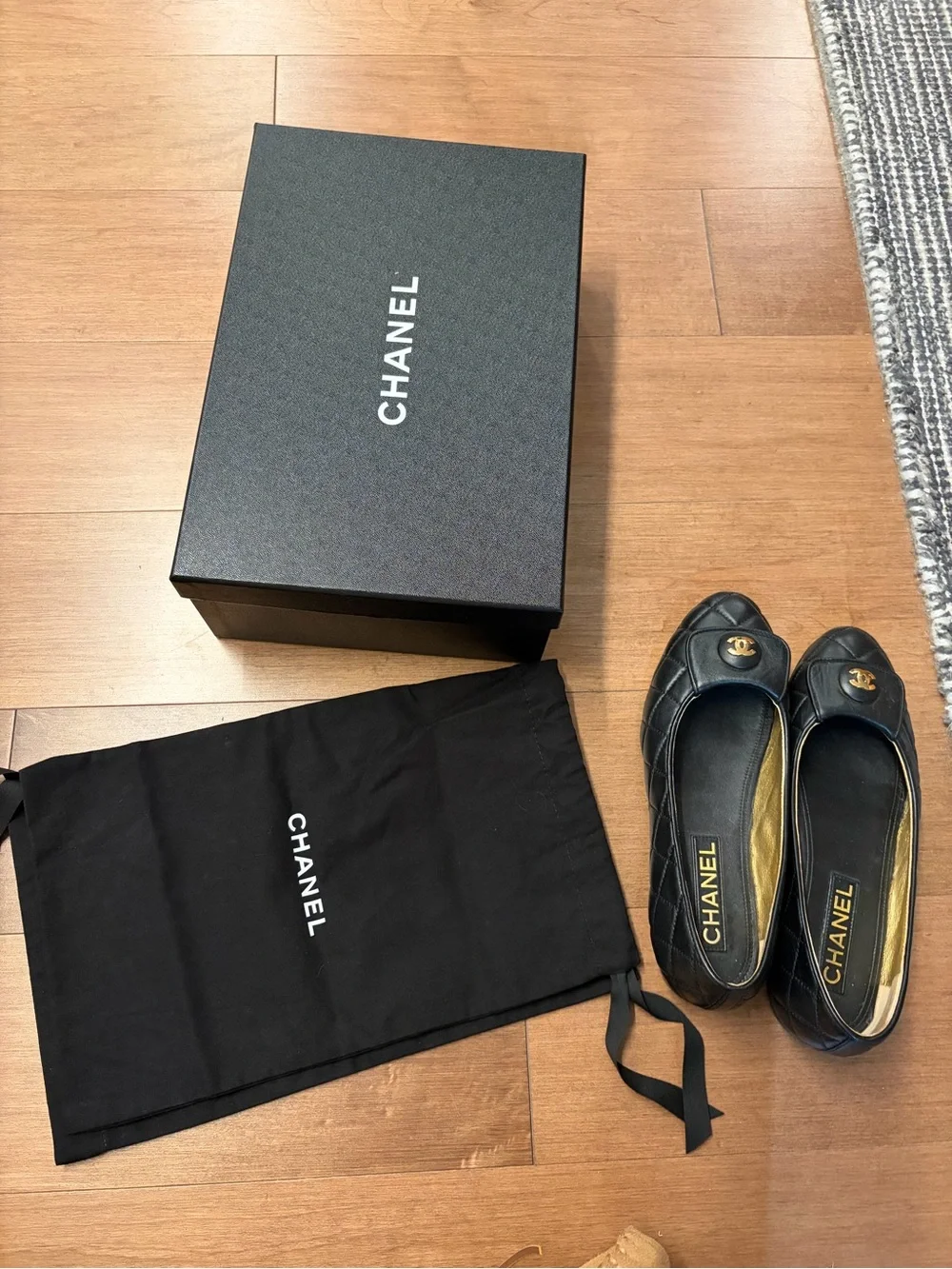 CHANEL Black Quilted Leather Ballet Flats with Gold CC Plaque